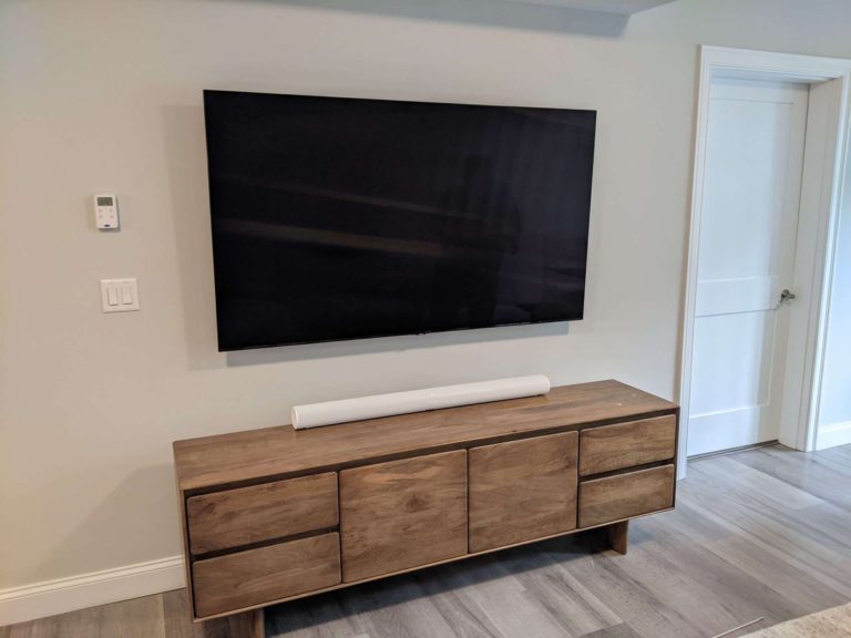 TV mounting with wires hidden behind the wall