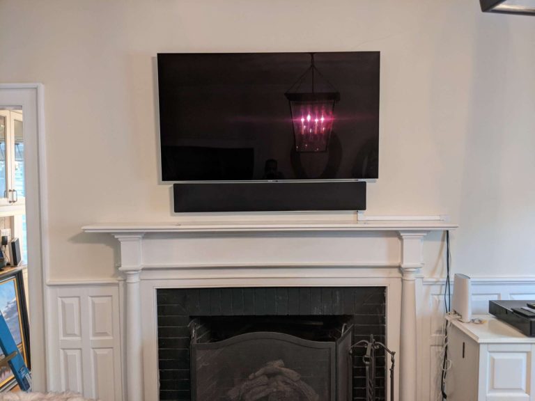 TV and soundbar mounting above fireplace.